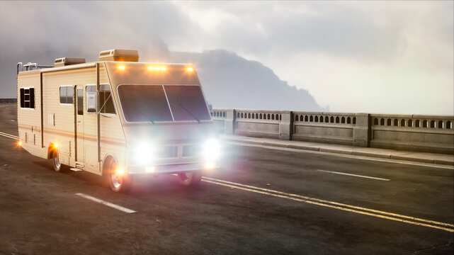 Motorhome van with headlights on drives over bridge in evening, against of gray clouds, on left side of frame, with copy space.