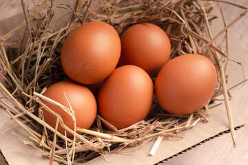 Chicken eggs on rice straw put in a box