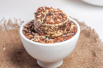 Raw riceberry in white cup.Healthy food.