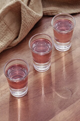 the glass of mocktail on the wooden table