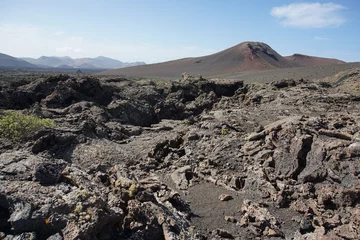 Foto op Canvas Volcanic landscapes of Lanzarote. Solidified lava, lava chimney, lava tunnel, sea of lava, eruption, canary islands, crater, volcano, black rocks, photographed in November 2022, trekking trip, © Paulina