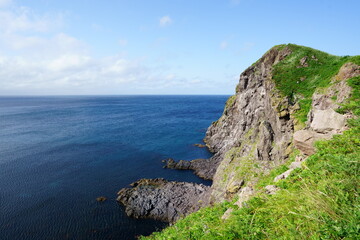 Fototapeta na wymiar Wild cliffs and ocean in Hokkaido 