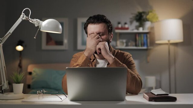 Pain in head relief. Man with headache and eye fatigue experiences relief of symptoms. Healing stress, fatigue, migraine and suffering