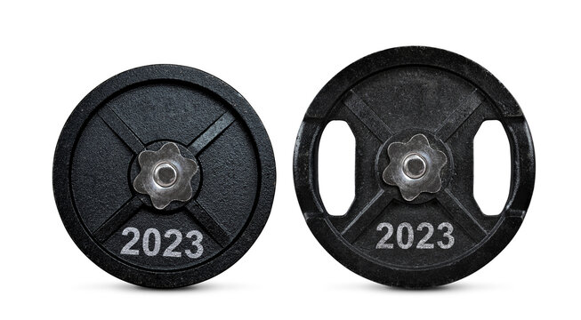 2023 written on the metal disc of dumbbells isolated on transparent background, PNG. Resolutions for the New Year.