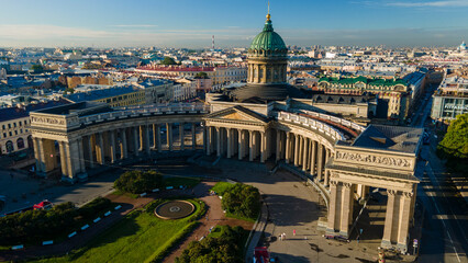 Fototapeta na wymiar Aerial around view of the Kazan Cathedral in the historical and at the same time modern city of St. Petersburg at sunny summer dawn, old gold