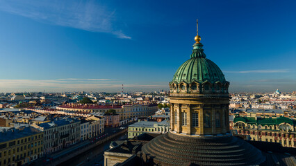 Fototapeta premium Aerial front, up view of the centre enter dome and colonnade of the Kazan Cathedral in the historical city of St. Petersburg at sunny summer dawn