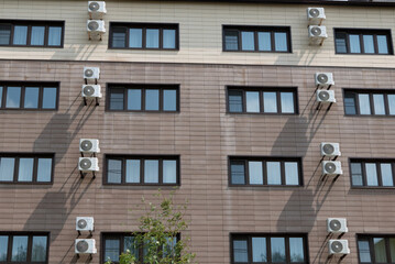 Obraz premium Air conditioner compressor installed outdoors wall