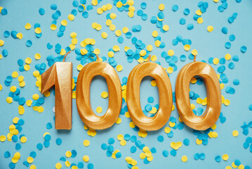 1000 one thousand followers subscriber card golden birthday candle on yellow and blue confetti Background. Template for social networks, blogs. celebration banner. 1000 online community fans. - 554476733