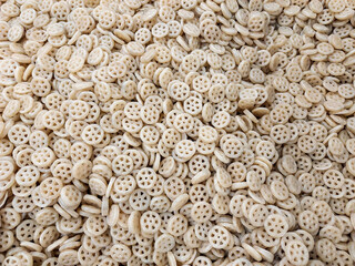 Closeup of raw fryums, food background, chips photography, flatlay top view of snacks backdrop , texture of stone