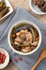 Delicious Taiwanese peeled green chili pepper chicken soup with mushroom and goji berry.
