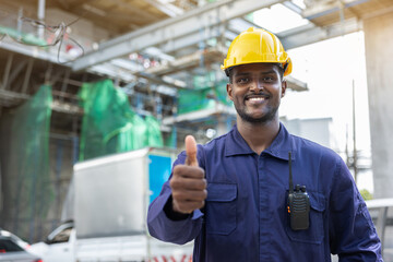 Construction worker standing with thumbs up Show confidence in working professionally. Great work and success in planning the work of the team. employment contract agreement