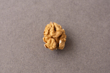 Walnut kernels on a gray background. Peeled walnut