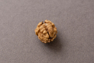 Walnut kernels on a gray background. Peeled walnut