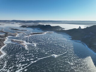 Lake Maibalyk and lake Borovoe separated by a mountain ridge in Burabai National Park. Cold wintry day. Aerial top view.