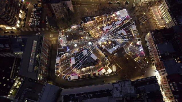Aerial drone view of Lille, France, at Christmas by night. Amazing 4K video of Christmas Market