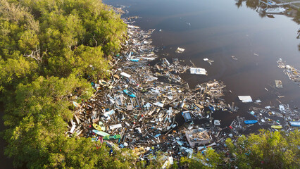 Piles of debris sit in the water of Estero Bay following Hurricane Ian. 