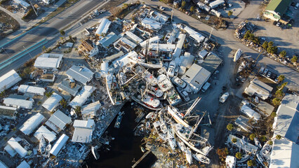 Fishing boats were pushed onto land by the historic storm surge from Hurricane Ian.