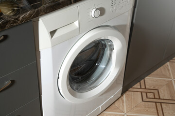White washing machine at home.