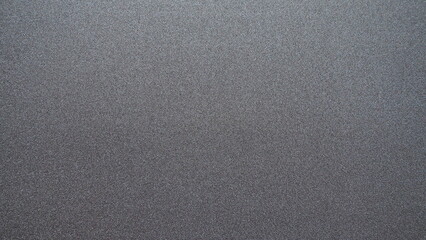 Fototapeta na wymiar Black glitter texture christmas background. Bent shiny velvet paper