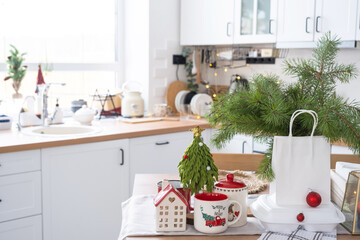 Food delivery service containers on table in white kitchen, festively served for celebration of Christmas and new year.  Saving time, hot order, disposable plastic box, craft package. mock up