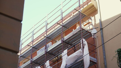 Building facade renovation restoration. Work Construction site of an older edifice