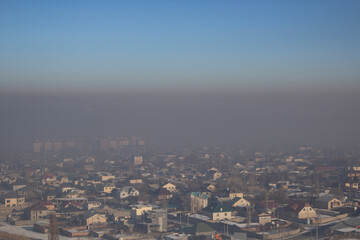 Fototapeta premium urban residential area in fog and smog