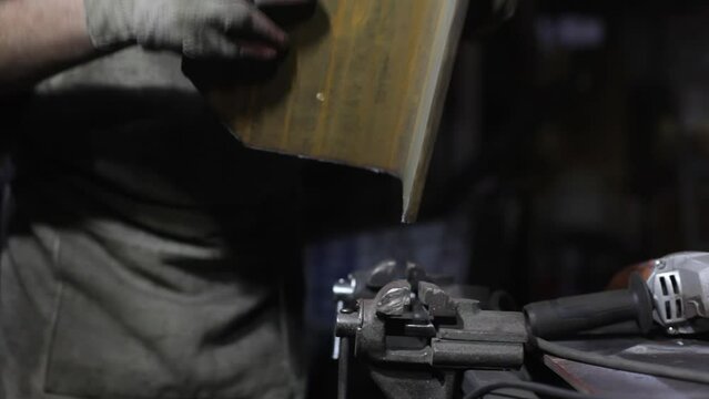 Metal processing. Steel billets. Work in the garage.