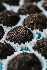 Macro close up of brigadeiros, traditional brazilian sweets made of chocolate and condensed milk