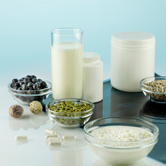 Calcium for health bones and joints. Products rich in calcium, supplements and X-ray film on a...