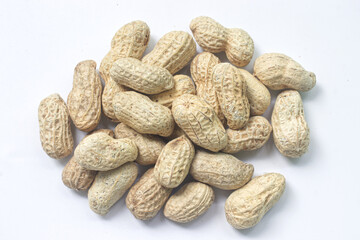 Pile of peanuts on white background, top view