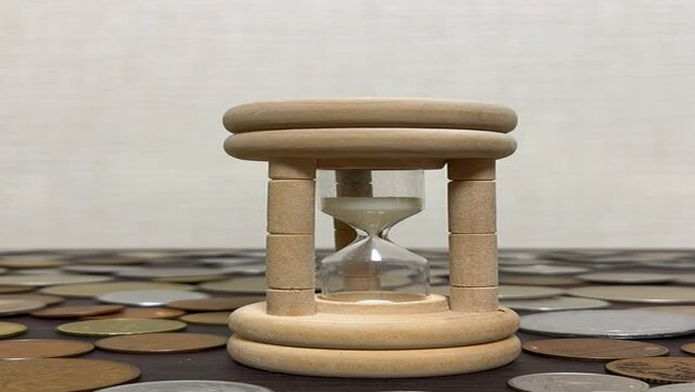 hourglass on wooden table