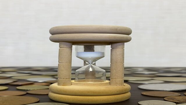 hourglass on wooden table 