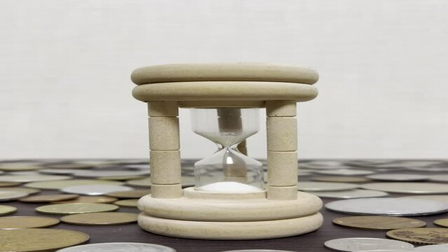 Hourglass and coins