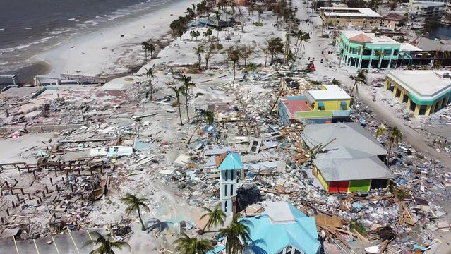 As day breaks on September 29, 2022, the damage from Hurricane Ian is seen for the first time on Fort Myers Beach, FL.