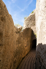 Tunnel excavated in the rock on the route of the Peña Cortada aqueduct in Calles. Valencia Spain