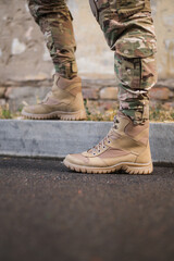 A soldier shod in special tactical khaki shoes
