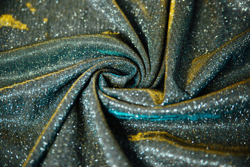 Shiny fabric drapery. Sewing material with sequins