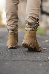 Leather waterproof boots on military. Demi-season high boots of khaki color