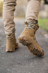 Leather waterproof boots on military. Demi-season high boots of khaki color