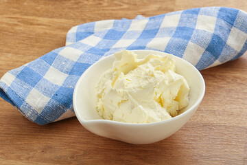 Italian soft mascarpone cheese in the bowl