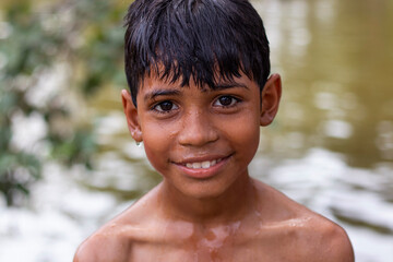 Portrait of Indian boy smiling - obrazy, fototapety, plakaty