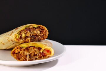 Pastor mexican burrito with meat and hot sauce