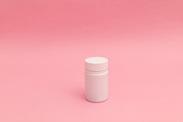 Pills on pink background