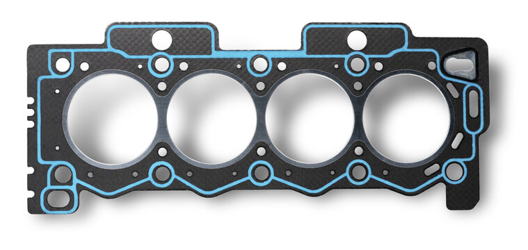 Close-up cylinder head gasket on a white background. The detail casts a shadow for volume.