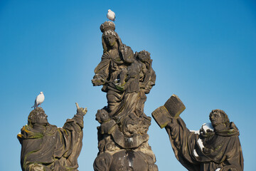 Statue of the Madonna, Ss. Dominic and Thomas Aquinas on Charles bridge, Prague. Czech Republic.