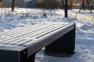 bench in the park covered with frost - Powered by Adobe