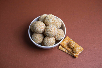 Indian sweet for traditional festival makar sankranti , Rajgira laddu made from Amaranth seed in Bowl on Brown background
