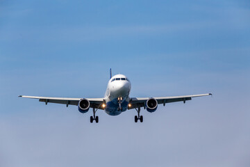 plane in the sky before landing