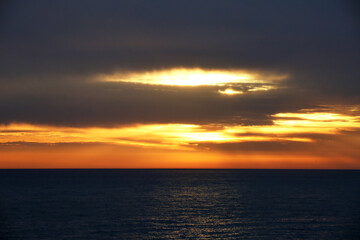 Naklejka na ściany i meble Picturesque sunset at the sea.