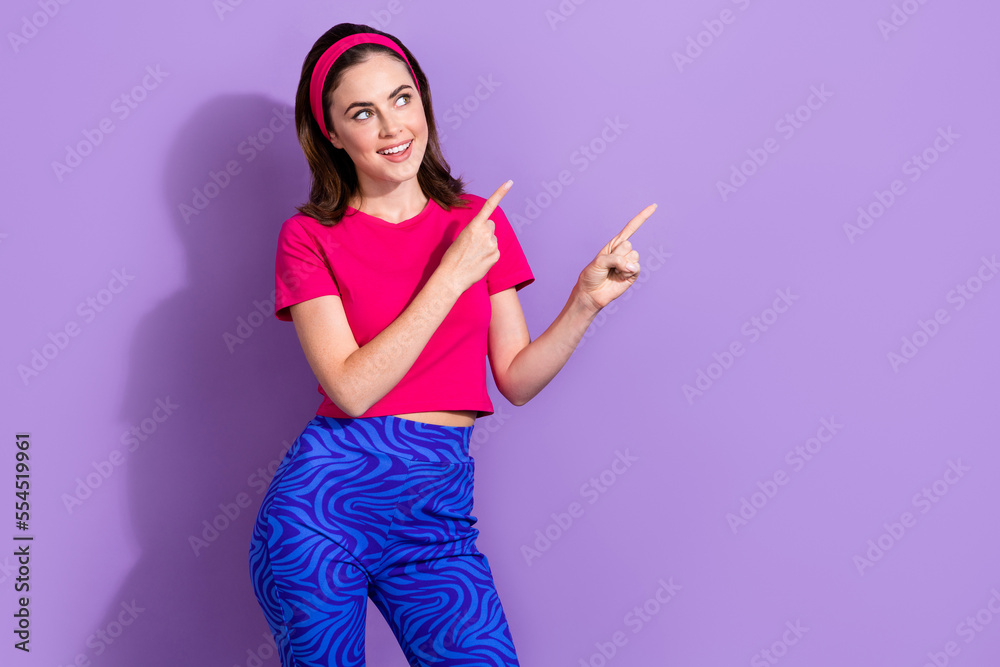 Sticker Photo of cheerful nice girl look direct fingers empty space offer news isolated on violet color background